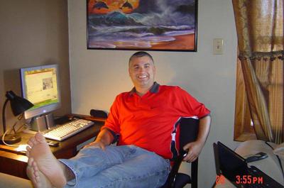 In his room on the ship. Notice the double-hung window, a standard on all ocean going vessels,