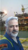 A PhotoShop Image of an Innocent Man on an Oil Rig Used by Nigerian Scammers